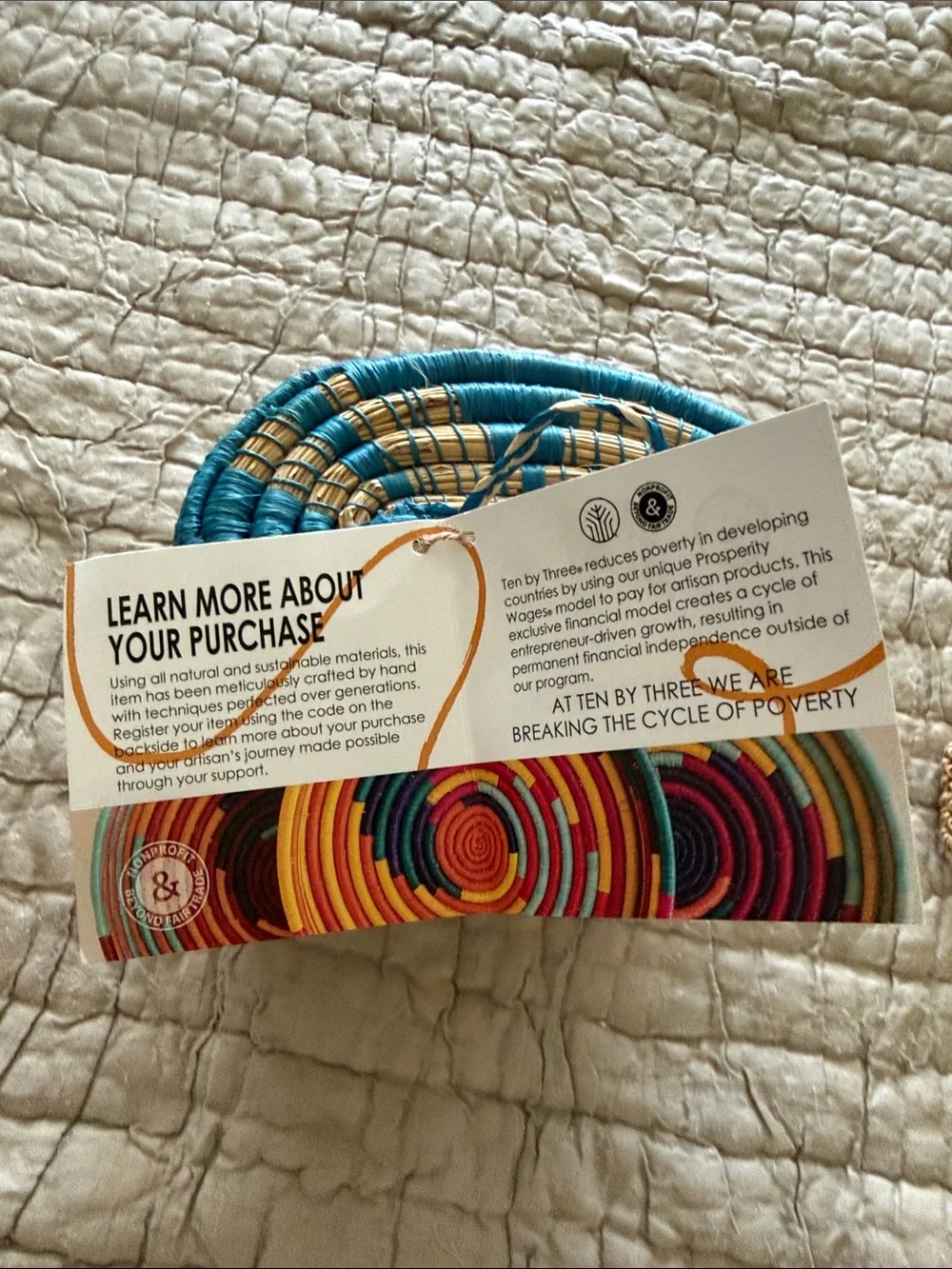 Handmade turquoise and tan coveted basket from Uganda clasp in the front